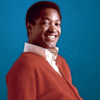 Sam Cook che canta sorride