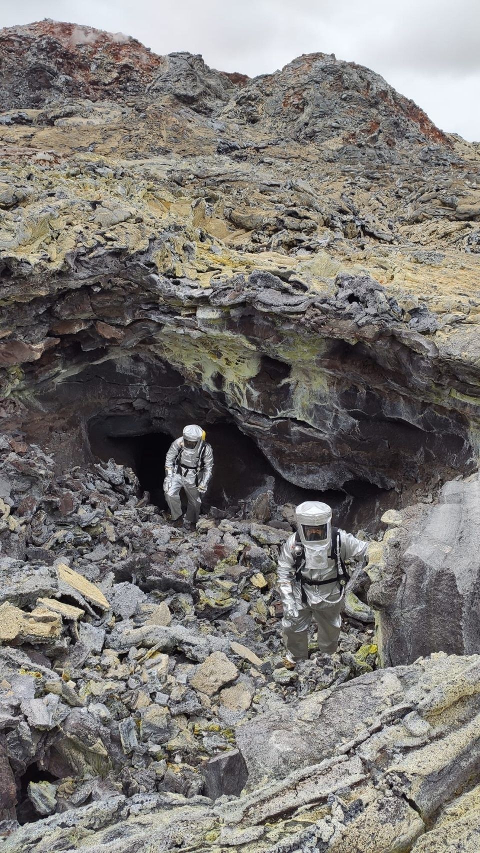 La Venta exploration team is coming out from one of the newly formed lava tube using special equipments for very high temperature environments