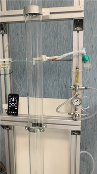 A picture of the upper part of the apparatus depicting part of the column and the aerosol injection via the nebulizer