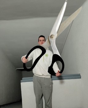 Adrien holding gigantic scissors