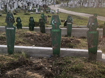 Green wooden Islamic grave markers