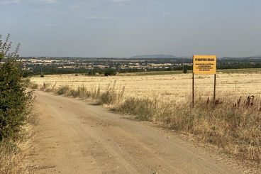 A dirt road near the village of Miratovac with a sign indicating the restricted zone near the border with North Macedonia